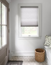 Cellular shades in a bathroom.